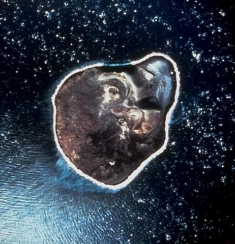 NASA vertical aerial photograph of Surtsey island from April 1968, showing the roughly circular island shape