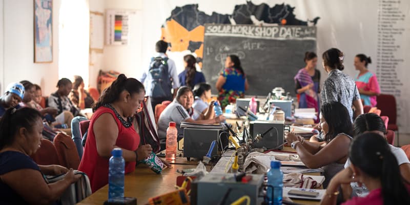 Women from over 12 countries sitting together in Barefoot College's solar engineering class in Rajasthan, India, 2019