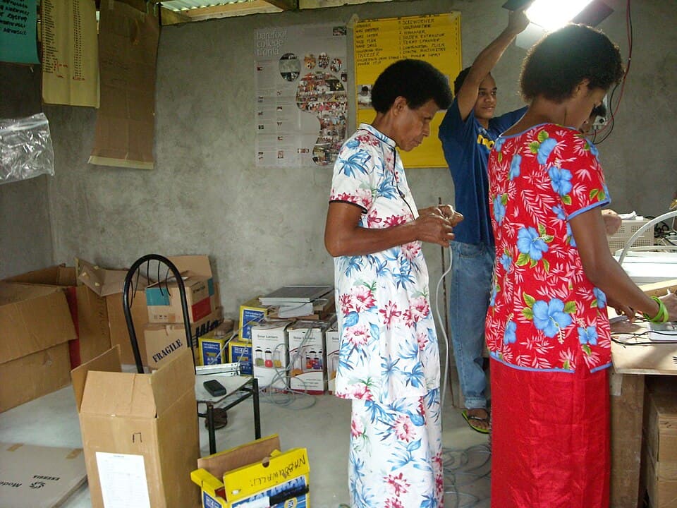 Barefoot College graduates demonstrating solar panel installation skills in Kadavu, Fiji